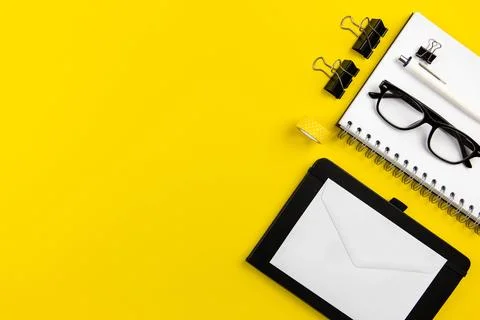 Modern office desk flat lay with spiral paper notepad, white envelopes mock.. Stock Photos