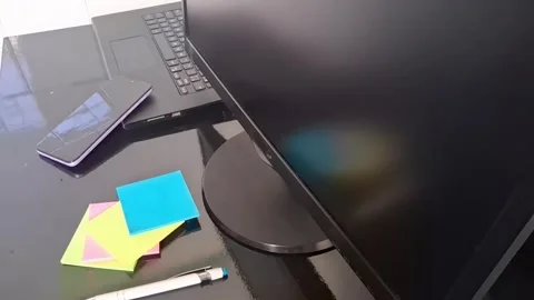 Modern office desk setup featuring computer monitor motion video footage Stock Footage 340038063
