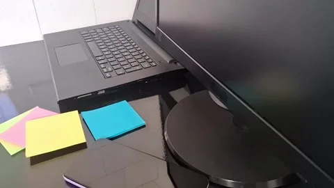 Modern office desk setup with laptop and sticky notes motion footage Stock Footage 340038079
