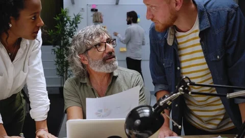 In the modern office: diverse group of colleagues have meeting, develop strategy Stock Footage 268644635