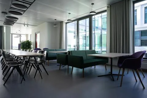Modern office kitchen and communal workspace Stock Photos