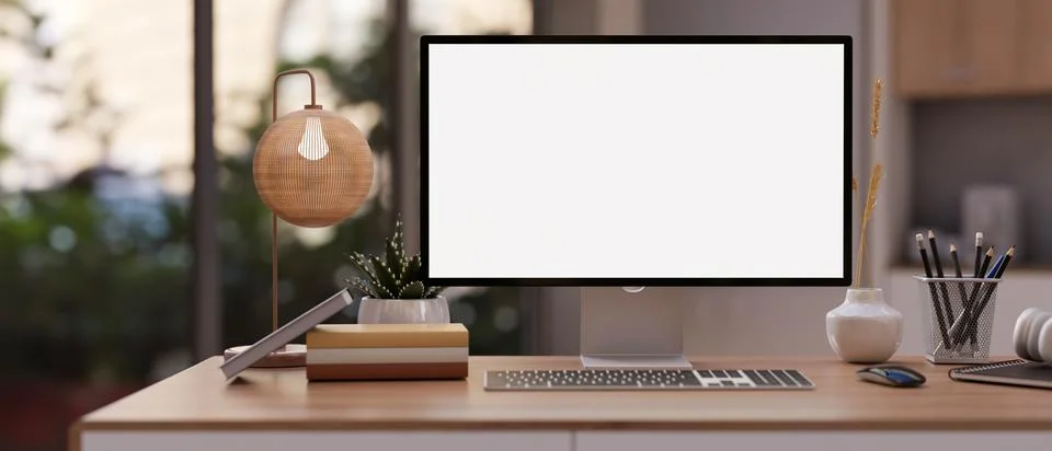 A modern office with a PC computer mockup, stationery, and a modern table l.. Illustrazione stock