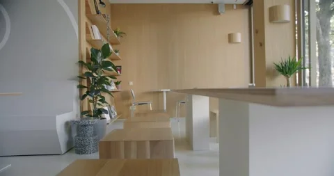 Modern Office Space with Wooden Elements and Green Plants 動画素材 318546241