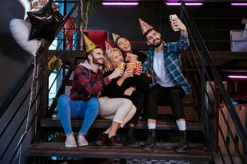 Modern office studio charismatic multiethnic workers take pictures while have a Stock Photos