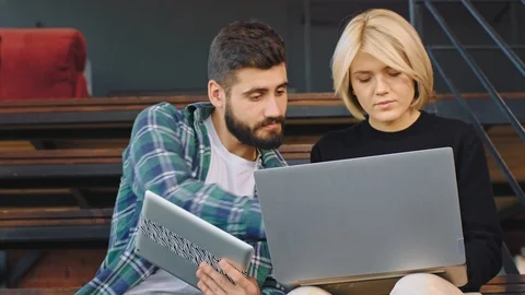 In a modern office studio group of multiethnic young people analyzing the plan Stock Footage 122592554