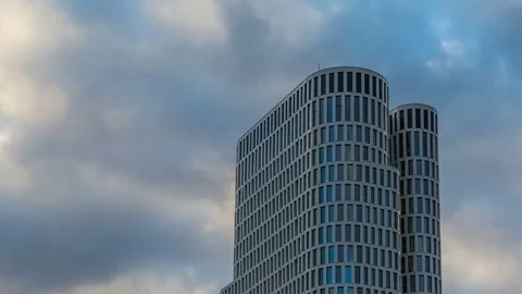 Modern office tower with clouds timelapse Stock-Footage 73990107
