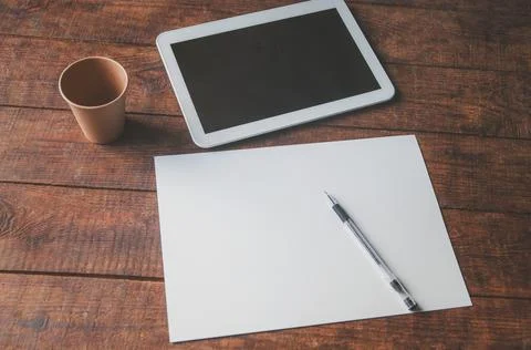 Modern office workplace with tablet pc on the table. On the table there is a  Stock Photos