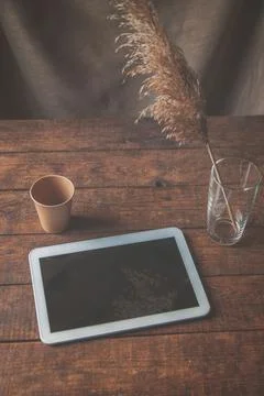 Modern office workplace with tablet pc on the table. On the table is a tablet Stock Photos