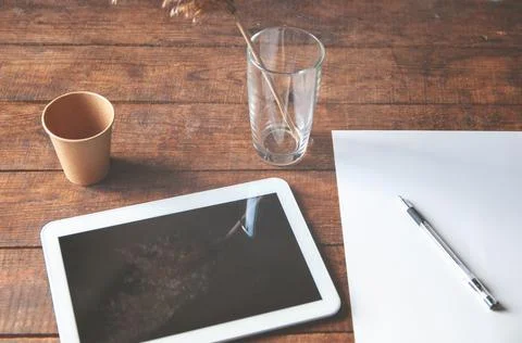 Modern office workplace with tablet pc on the table. On the table is a tablet Stock Photos