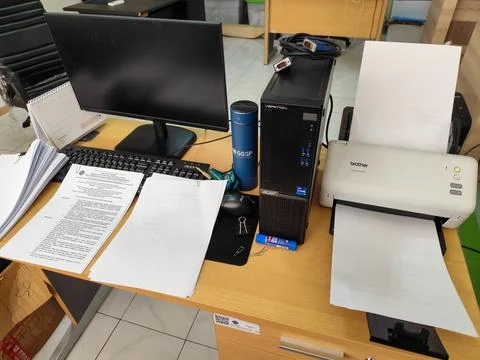 Modern Office Workspace with Computer, Scanner, Documents and Organized Desk 库存照片