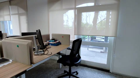 Modern Office Workstation with Computer and Ergonomic Chair Near Window Stock Footage 338321423