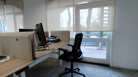 Modern Open Office Workspace with Computer Desk and Empty Ergonomic Chair Stock Footage 338321156