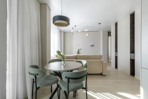 Modern Open-Plan Apartment Interior with Dining and Living Zones Stock Photos