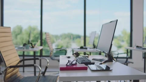 Modern open plan office interior with empty workstations computers and pano.. Stock Footage 337532892