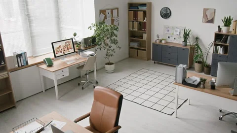 Modern Open Space Office with Computer Desks Standing in Bright Room Stock Footage 328601459