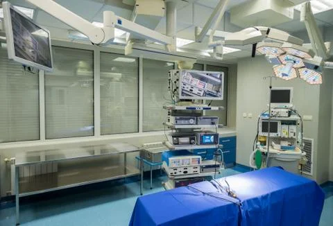 Modern operating room with surgery table, effective lights and life support s Stock Photos