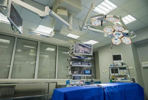 Modern operating room with surgery table, effective lights and life support s Stock Photos