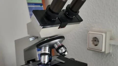 Modern Optical Microscope in Professional Laboratory Clinical Setting Stock Footage 334479724