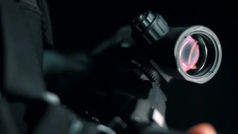 Modern optical sighting system on a combat rifle. Close-up. Stock Footage 144068969