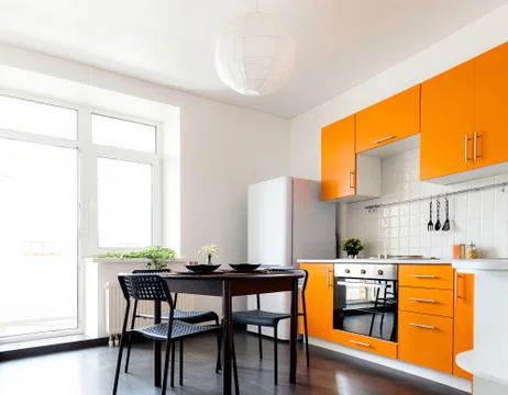 Modern orange kitchen Stock Photos