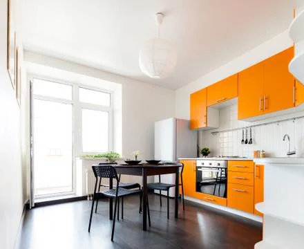 Modern orange kitchen Stock Photos