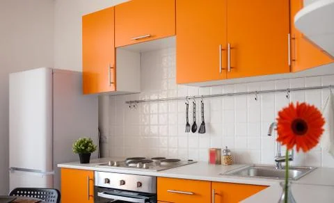 Modern orange kitchen Stock Photos