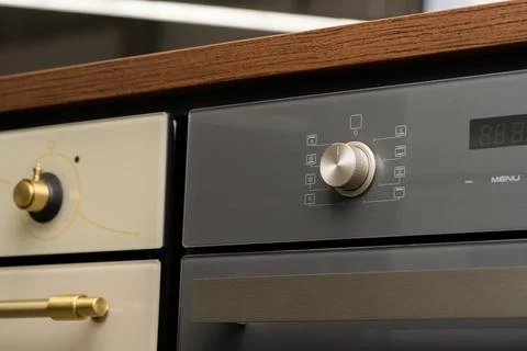 Modern oven mode control button close up Stock Photos