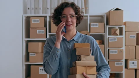 Modern packaging business Warehouse worker Concentrated work in the goods wa Stock Footage 233523859