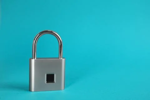 Modern padlock on light blue background. Space for text 스톡 사진