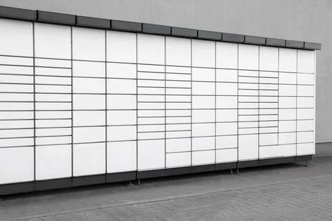 Modern parcel locker with many postal boxes outdoors Stock Photos
