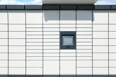 Modern parcel locker with many postal boxes outdoors Stock Photos