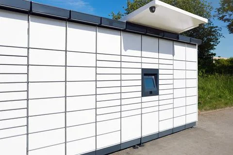 Modern parcel locker with many postal boxes outdoors 写真素材