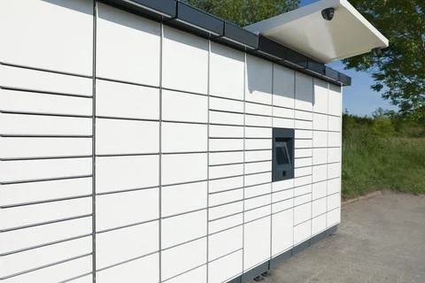 Modern parcel locker with many postal boxes outdoors 写真素材
