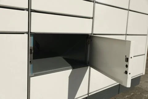 Modern parcel locker with open box, closeup view 스톡 사진