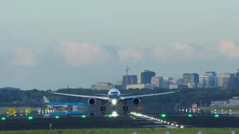 Modern passenger airliner accelerating down the runway and soaring into the sky Stock Footage 288709552