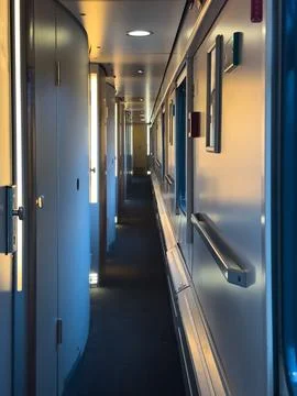 Modern Passenger Train Corridor with Compartments and Interior Perspective .. Stock Photos