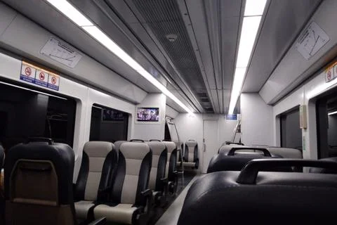 Modern Passenger Train Interior with Comfortable Ergonomic Seats Stock Photos
