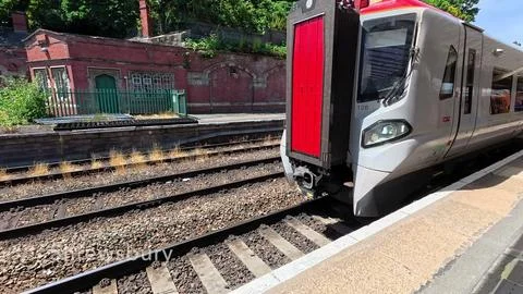 Modern Passenger Train at Railway Platform Stock Photos