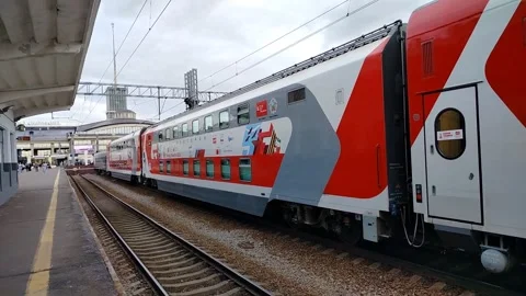 Modern passenger train stands at the platform awaiting departure Stock-Footage 312263457