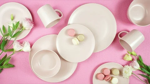 Modern pastel pink tableware on pink background. Creative concept layout. Stock Footage 129205416