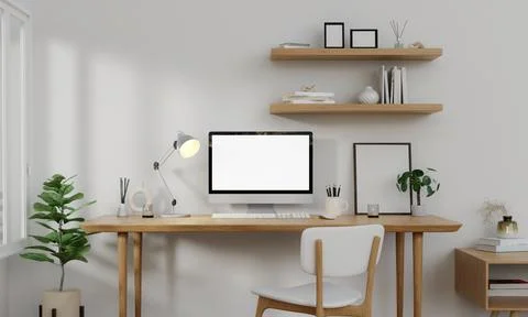 A modern PC computer blank screen mockup is on a table in a modern minimal home Illustrazione stock