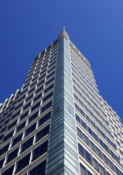 Modern peaked corner skyscraper vertical Stock Photos