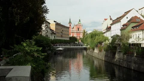 Modern pedestrian bridge Ribja Brv in the center of Ljubljana Stock Footage 211795960