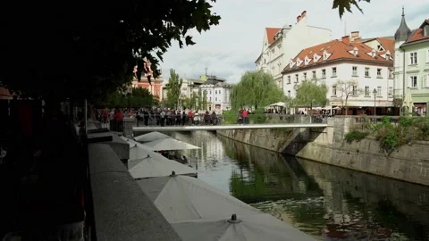 Modern pedestrian bridge Ribja Brv in the center of Ljubljana Stock Footage 211796003