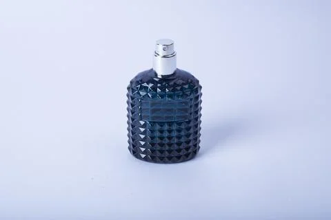 Modern perfume bottle on white Stock Photos