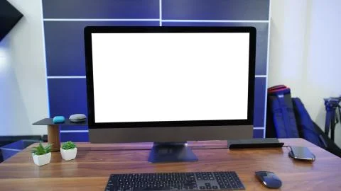 Modern personal computer with blank white screen, keyboard, mobile phone and  Stock Photos