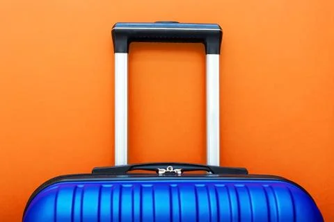Modern Phantom Blue classic blue suitcase on Lush Lava background close up co Foto stock