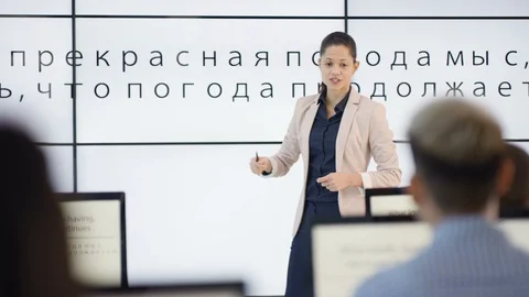 Modern physics teacher teaching engineering university students Stock Footage 106670711