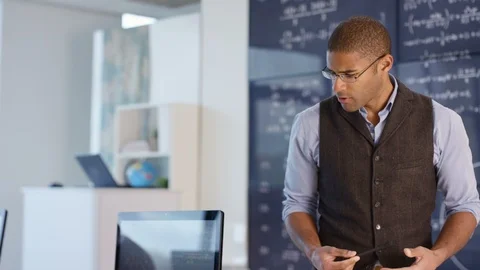 Modern physics teacher teaching students during lecture Stock Footage 106673593