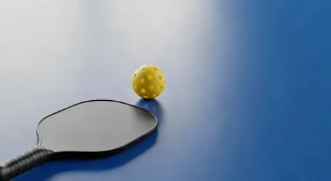 Modern Pickleball Paddle Without Logo and Ball on Blue Court Stock Footage 317662224